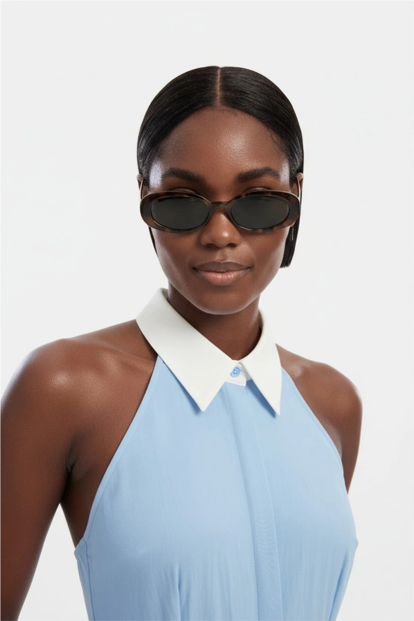 AI model wearing a light blue halter top and sunglasses.